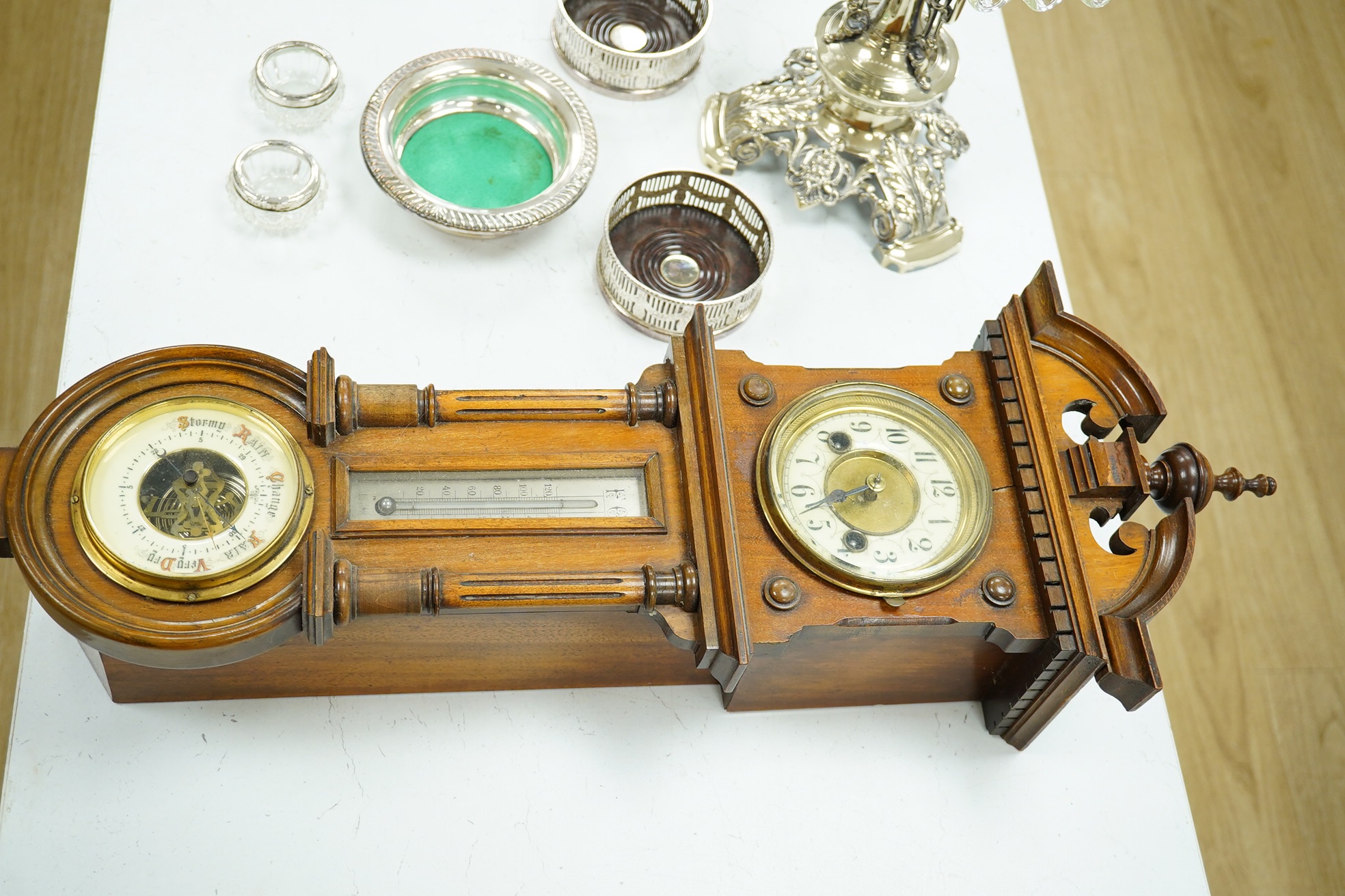 A late 19th century walnut wall clock, barometer and thermometer combination, striking on a coiled gong, 65cm high. Condition - fair, crack to the case and finial missing to the bottom